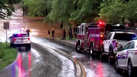 Alamy Image shows emergency crews at a flooded area in Lynchburg, Virginia