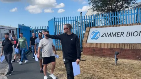 BBC Workers leaving the Zimmer Biomet