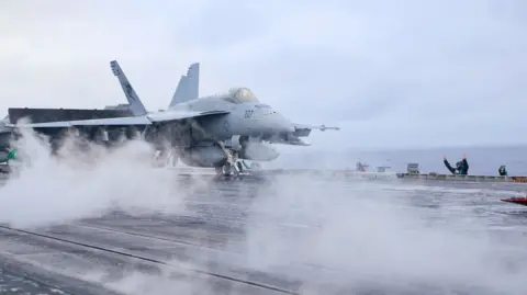 US fighter jet on board aircraft carrier USS Carl Vinson