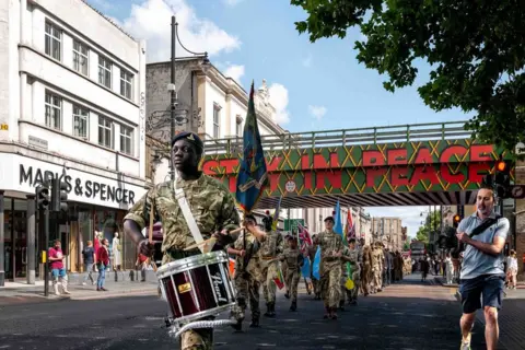 Jim Grover Windrush day parade in Brixton