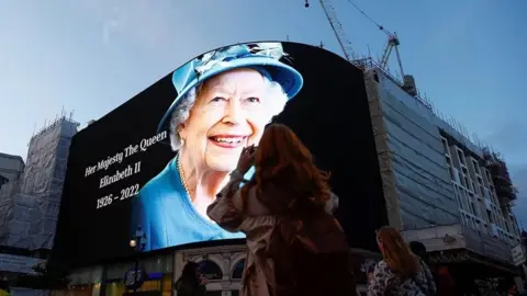 Reuters Image of the Queen on a billboard