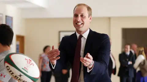 Getty Images Prince William tosses a WRU rugby ball