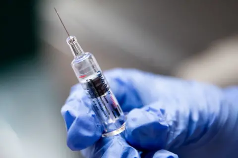 Sergei Bobylev A syringe containing a flu vaccination.