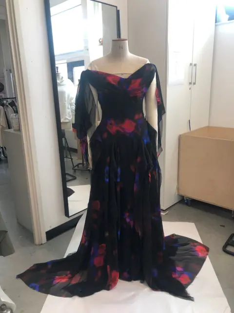 Row Seward A black dress with red and blue detail on a mannequin