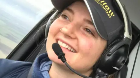 Olivia Watson in the helicopter