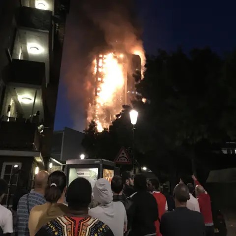 Getty Images Bystanders watching the fire