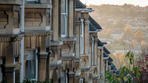A GV of a row of houses on a UK street