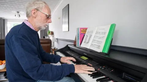 British Heart Foundation Glynn Evans playing the piano