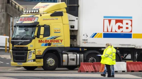 Liam McBurney/PA Daera port checkers at Larne port