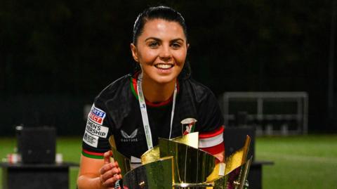 Jessica Foy poses with the Women's Premiership trophy