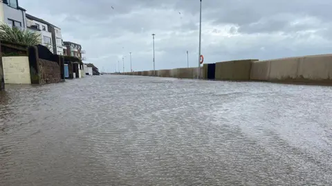 Ed Barnes/LDRS A flooded South Parade in West Kirby showing water flooding the promenade