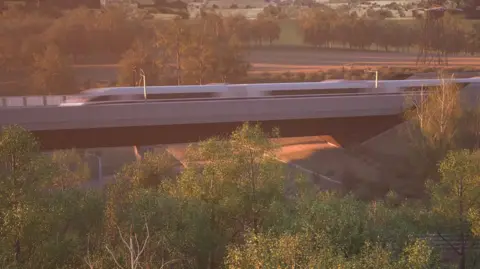 Artist's impression of HS2 Small Dean Viaduct . It shows a blurry speeding train part-way over a bridge surrounded by trees, with fields and more trees beyond.