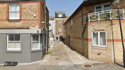 Google A Google Street image of Mansion Street in Margate, which is a one-way lane between two buildings.