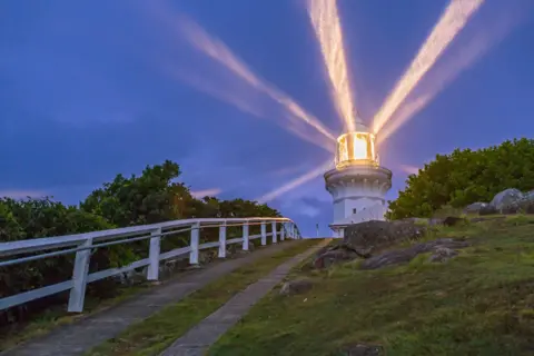 Getty Images The Smokey Cape Lighthouse with its beams in the cloudy evening twilight shining in the light rainfall. This is near South West Rocks on the Mid-North Coast of New South Wales, Australia. Built in 1891