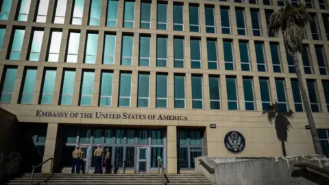 US Marines stand outside the Embassy of the United State of America in Havana, on February 21, 2018