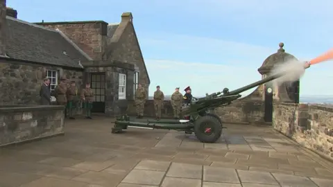 Harry and Meghan stood back and wore ear defenders as the One O'Clock Gun was fired