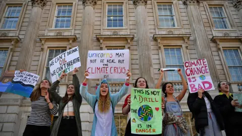 AFP/Getty Young protesters with placards