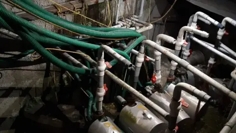 Joshy Maliyekkal The contaminated water from the well being pumped out