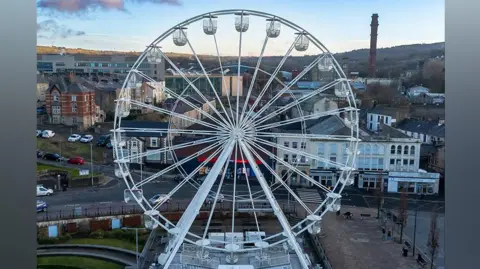 Dan Conway Photography Aerial view of the white observation wheel, with Darwen in the background