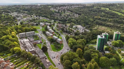 FilmFam An aerial view of Gleadless Valley shows maisonettes, tower blocks, houses and greenery