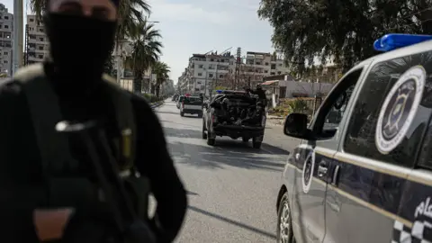 EPA Syrian security forces patrol a street in Jableh, Latakia province, Syria (9 March 2025)