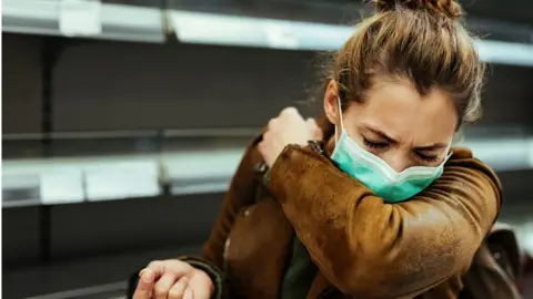 Getty Images woman coughing