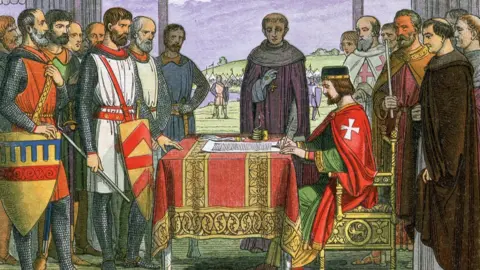 Getty Images Illustration of King John signing the Magna Carta, with Archbishop Stephen Langton and the Barons in 1215 AD, from a Chronicle of England by James Doyle