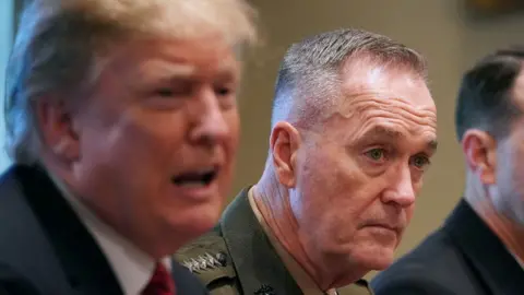 Getty Images Gen Dunford at a press conference with President Trump in April