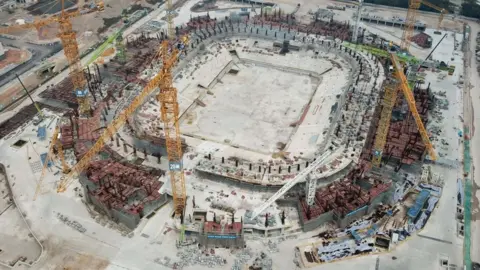 Getty Images An aerial photo taken on 20 March, 2022 of the Guangzhou Evergrande Football Stadium under construction in Guangdong Province, China.