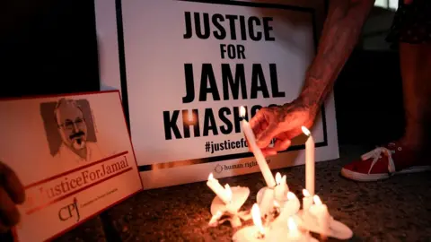 Reuters Candle-lit vigil for Jamal Khashoggi near the Saudi embassy in Washington (2 October 2019)