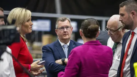 PA Media The DUP's Diane Forsythe with party leader Sir Jeffrey Donaldson and supporters at the Titanic Exhibition Centre, Belfast, as vote counting takes place