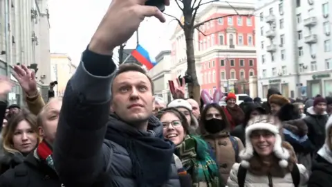 ALEXANDRA DALSBAEK Alexei Navalny takes a selfie with protesters in Moscow.