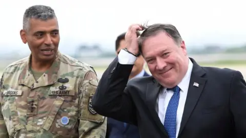 Reuters US Secretary of State Mike Pompeo, right, arrives in Seoul, 13 June 2018