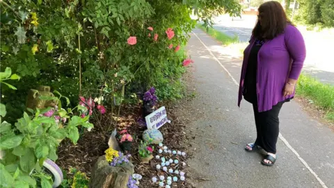 Jane Hofmeister at the shrine for Amy on Blackbrook Way