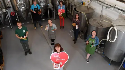 Wales News Service Angharad Underwood, bottom right, and other members of the Wye Valley Producers cooperative.