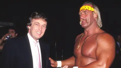 Donald Trump and World Champion Wrestler Hulk Hogan shake hands at Wrestlemania Vl Convention Hall in Atlantic City, New Jersey, on 29 March 1987