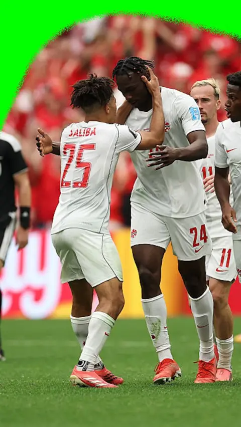 Nathan Saliba and Promise David celebrating the goal