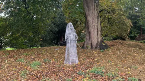 BBC/ Emily Johnson A wire statue depicting a nun with rosary beads in York Museum Gardens