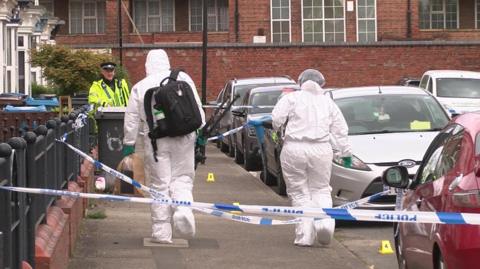 Police and forensic officers at Malm Street, Hull 