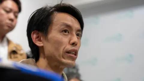 EPA Close-up of Lo Kin-hei as he speaks to reporters