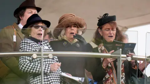 PA Media The Queen with friends at the races