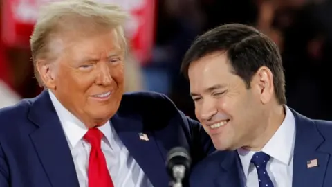 Reuters File gambar Donald Trump dan Marco Rubio