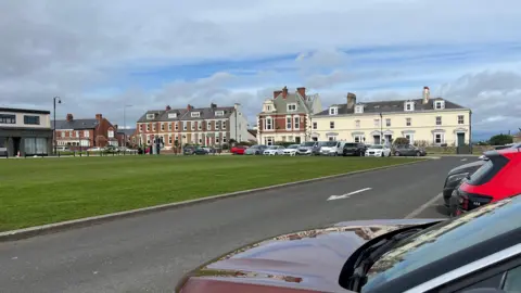 BBC North Street in Seaham with cars parked in front of some posh houses 