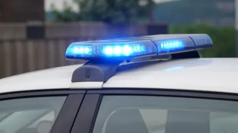 Lit up sirens on top of a police car