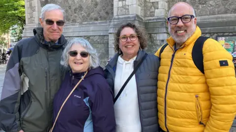 A group of tourists from New Jersey - there are two men and two women.