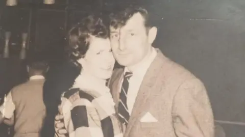 Supplied A man and woman in a black and white photo dancing on their wedding day