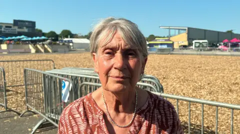 Maureen Trott looks at the camera in front of an empty show pen at the Bath and West showground.
