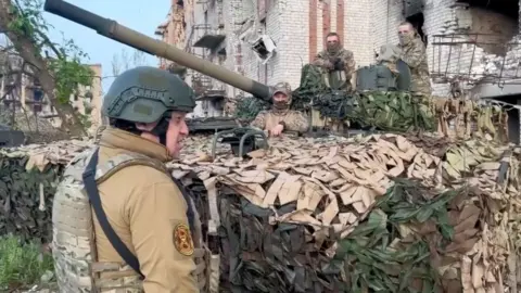 Reuters Yevgeny Prigozhin speaks to Wagner soldiers in Bakhmut