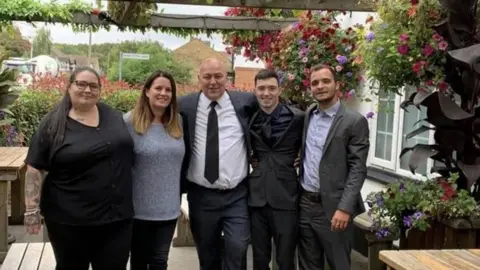 Mark Garland A group of people standing together