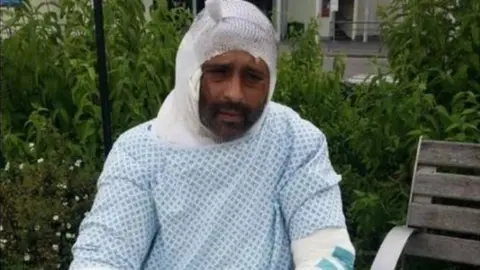 Jameel Muhktar in hospital gown